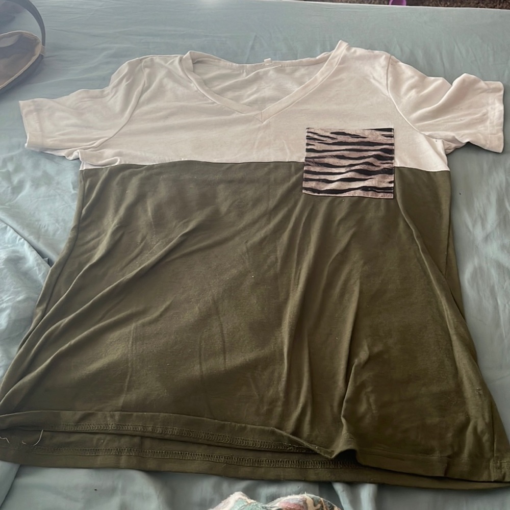 Green and white with a leopard print pocket.